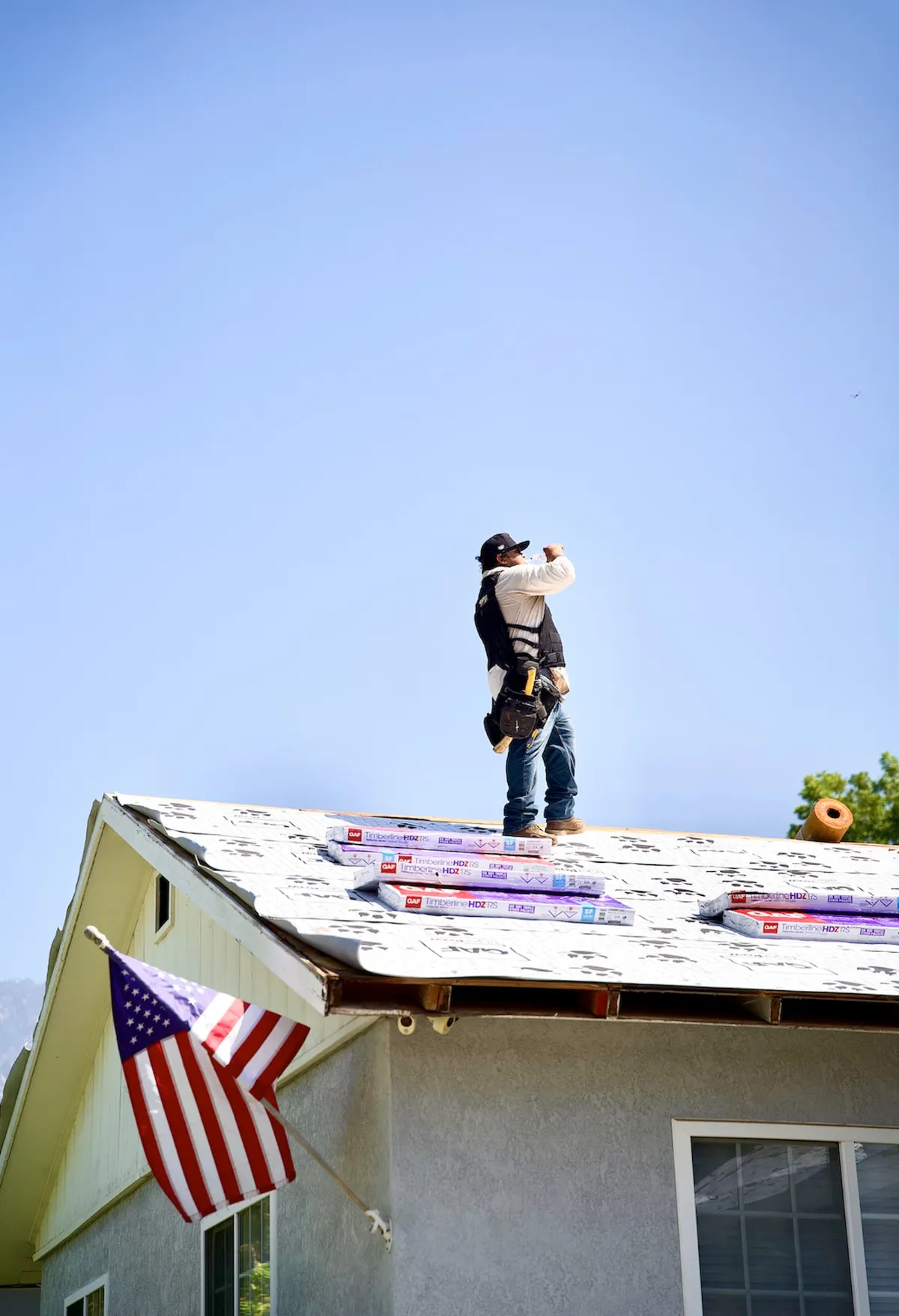 Roofer on a GAF Timberline shingle installation
